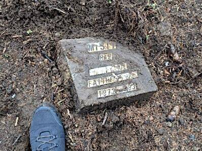 Grave marker in the dirt at former Surrey Pet Cemetery site on March 4, 2026. (Contributed/Steve Gardner photo)